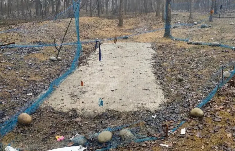 Kashmiri youth in Heff, fed up with government delays, construct their own cricket pitch